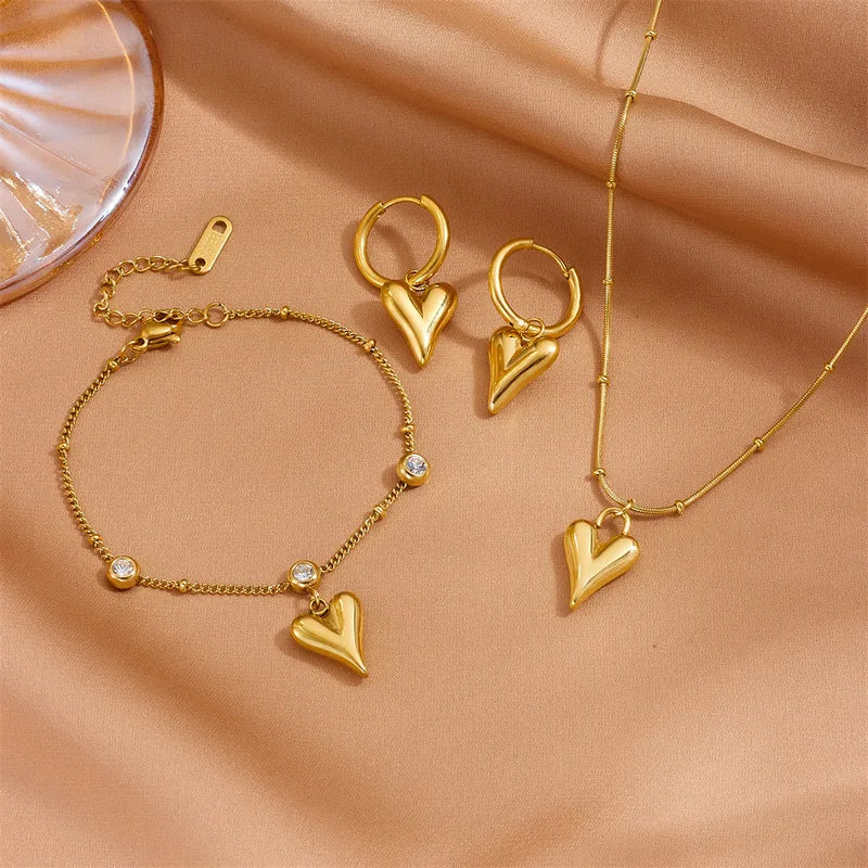 Goudkleurig sieraden set met 3D hart