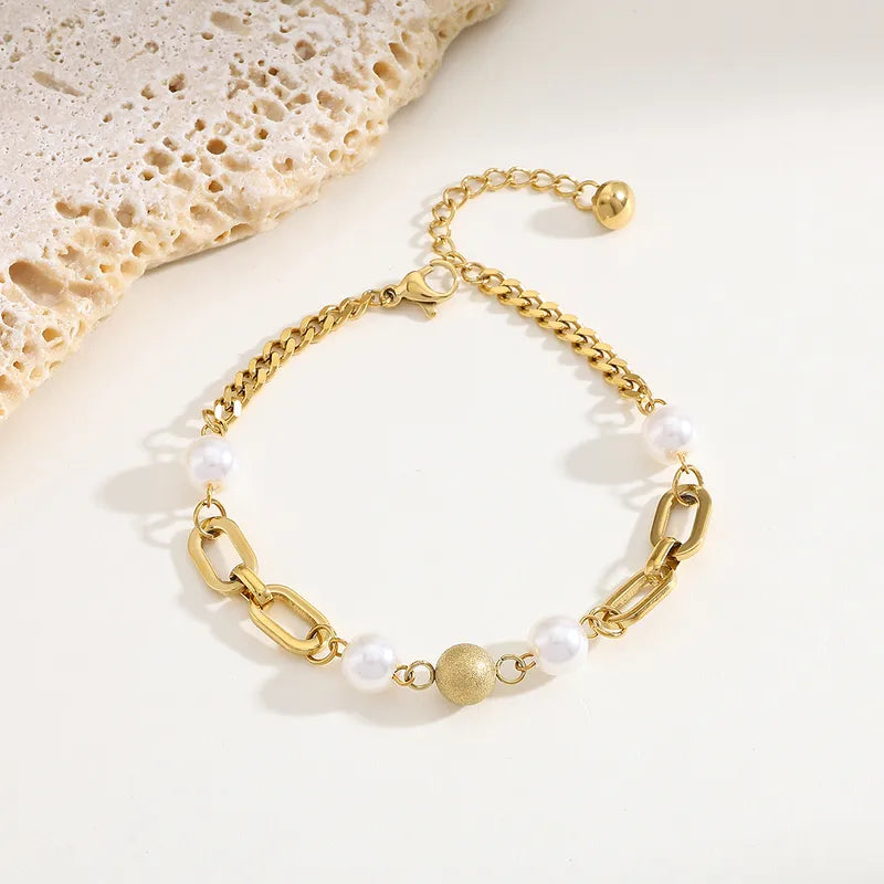 Armband met schakel en parels goud