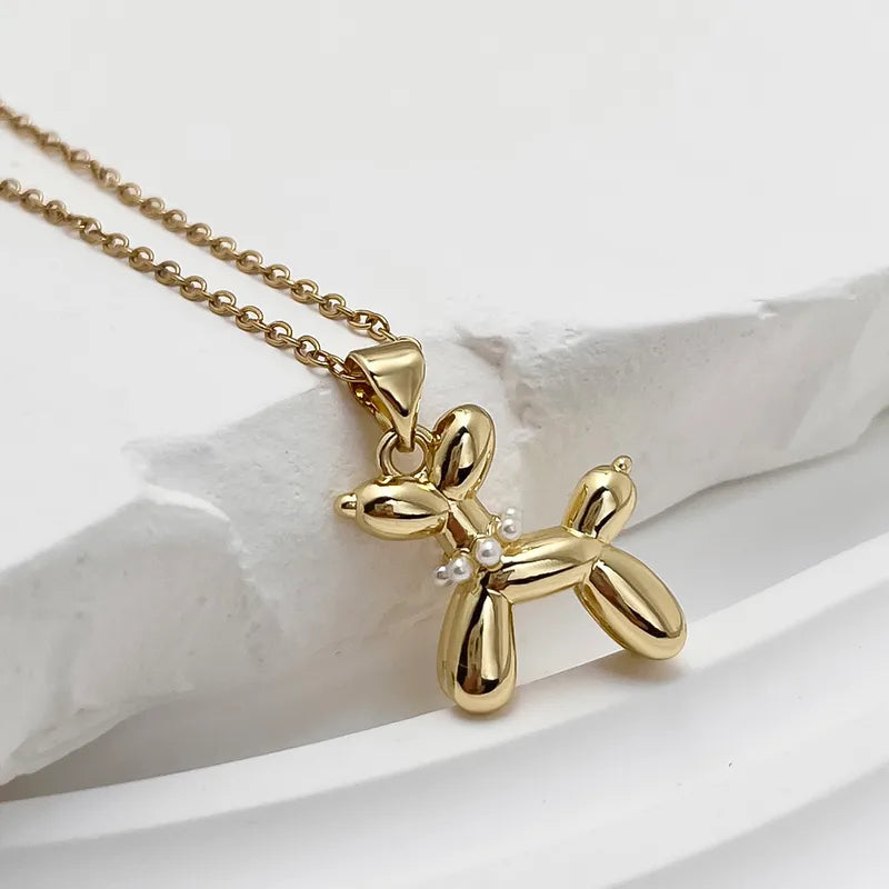 Ballon dog met ketting goudkleurig met pareltjes