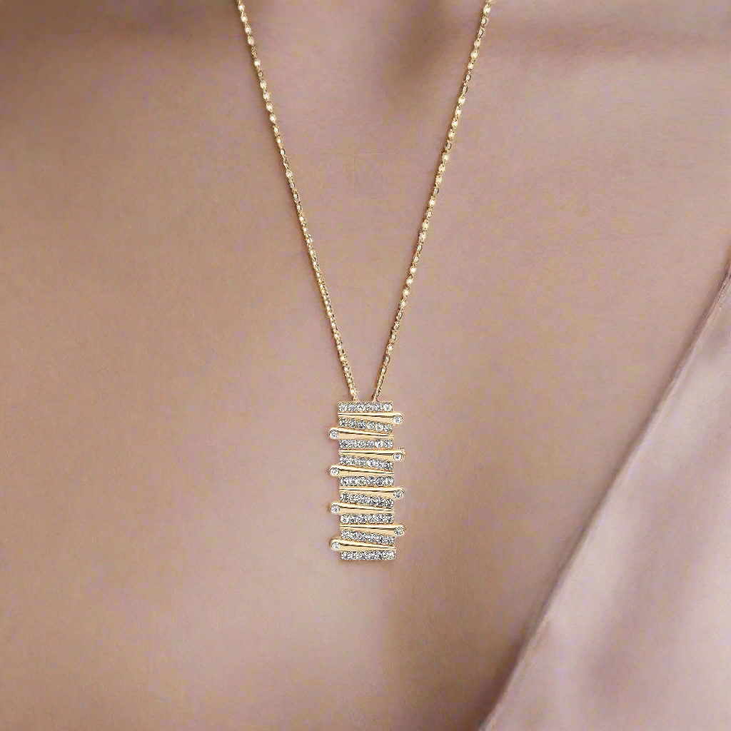 Goudkleurige langwerpige ketting gevuld met strass-steentjes BEjewels