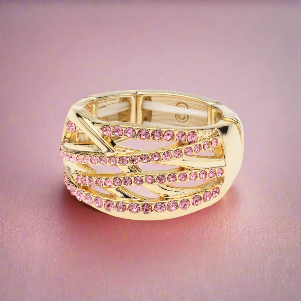 Goudkleurige elastische fantasie ring met roze steentjes BEjewels