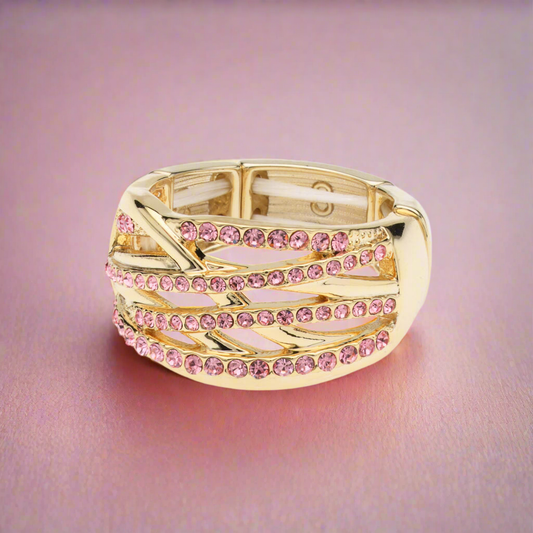 Goudkleurige elastische fantasie ring met roze steentjes BEjewels