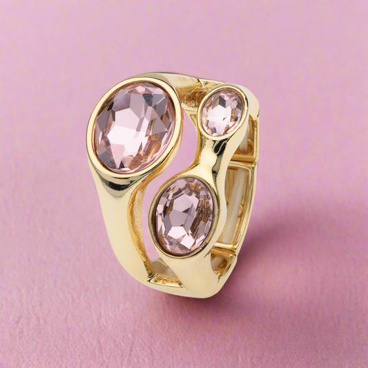 Goudkleurige elastische ring met 3 roze stenen BEjewels