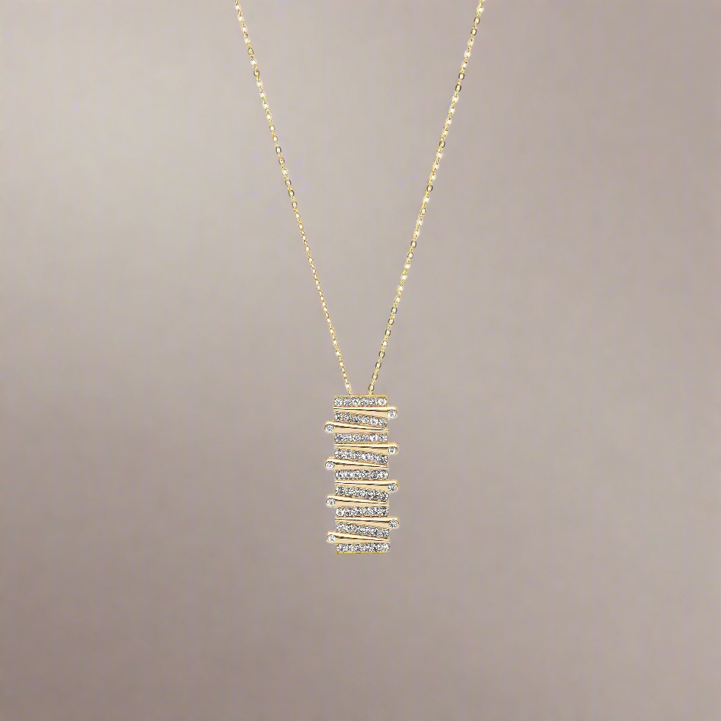 Goudkleurige langwerpige ketting gevuld met strass-steentjes BEjewels