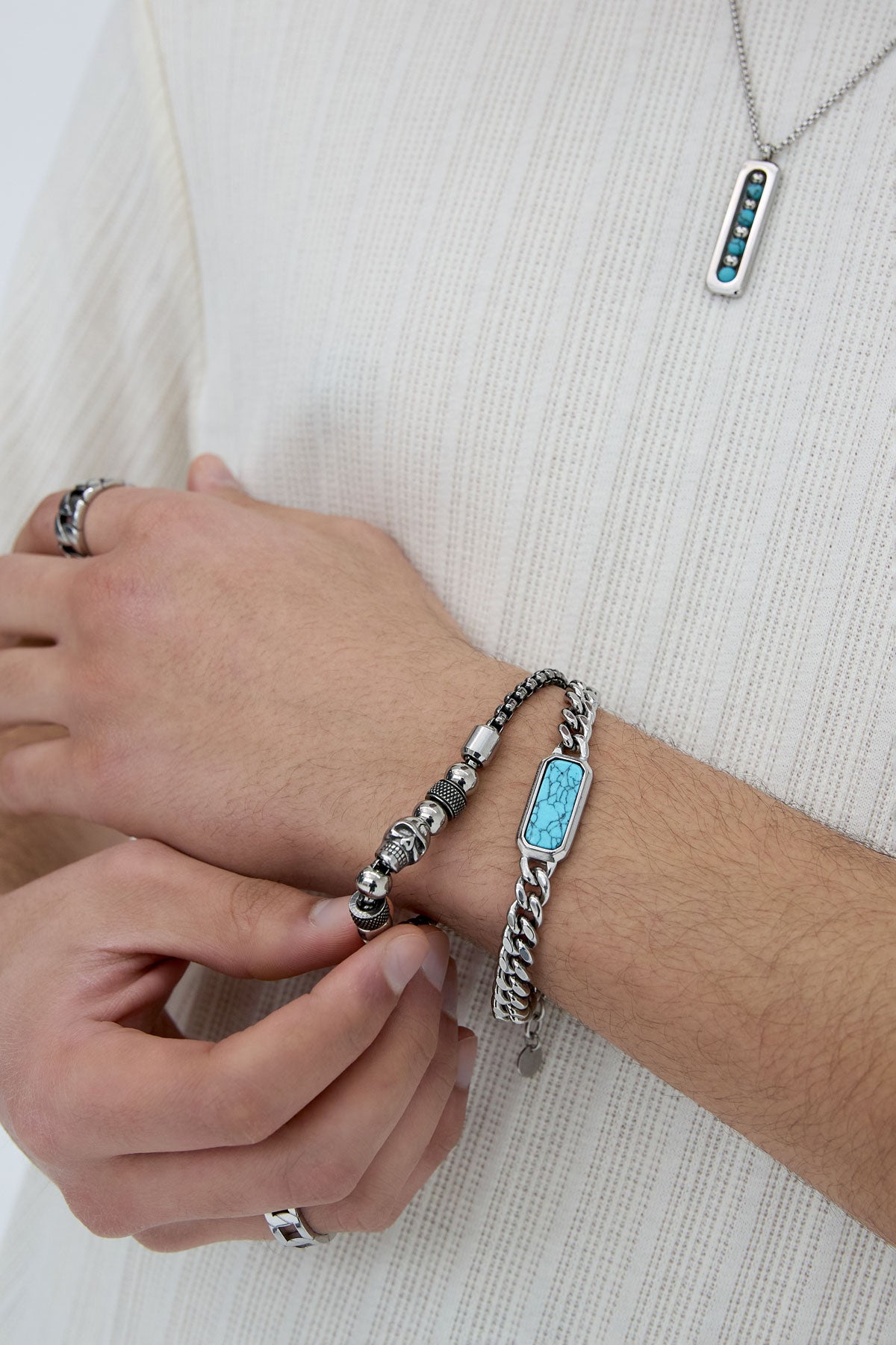 Zilverkleurige heren schakelarmband met turquoise steen