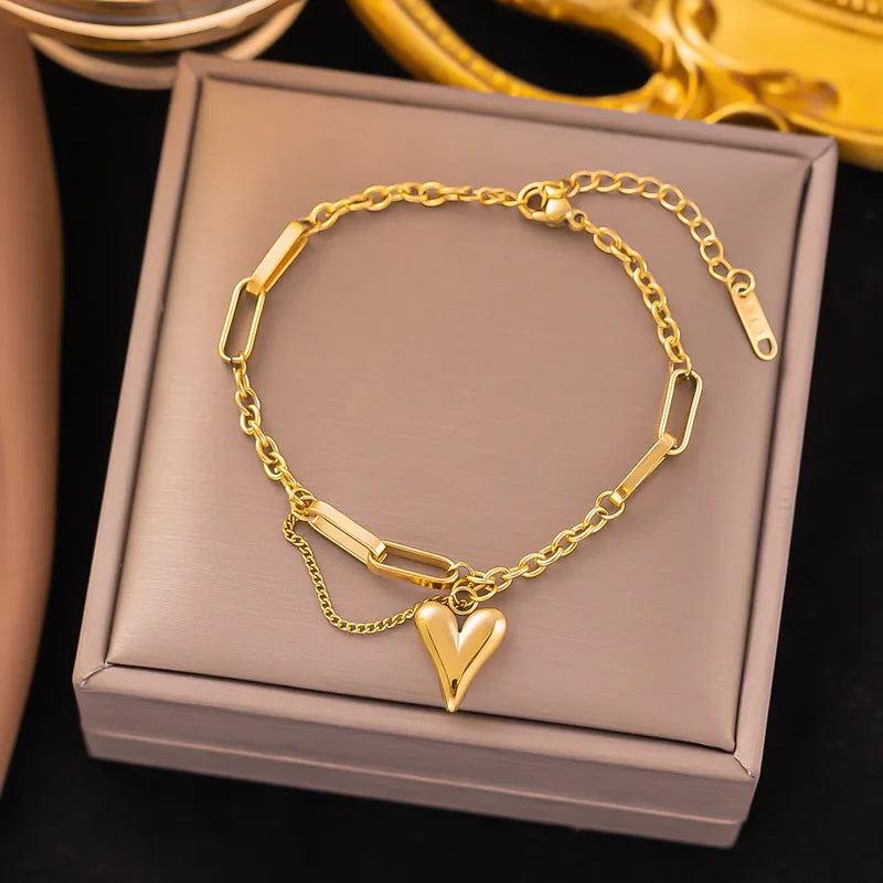 Armband hart met schakels en fijn ketting goudkleurig