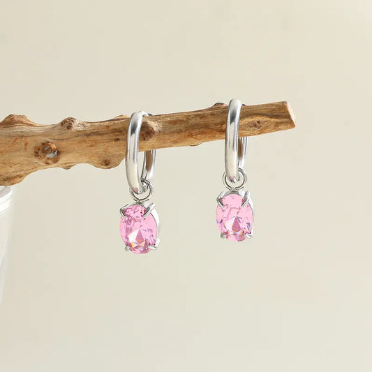 Zilverkleurige Creolen met een roze Zirconia
