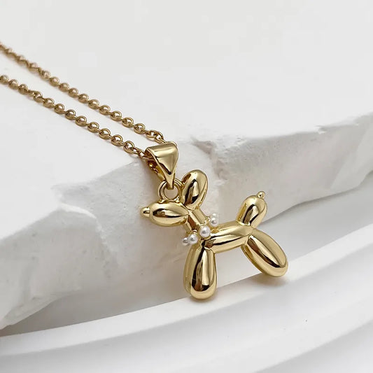 Ballon dog met ketting goudkleurig met pareltjes