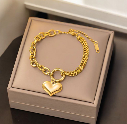 Armband goudkleurig met twee verschillende schakels en hart